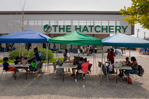 Event tents in front of The Hatchery sign